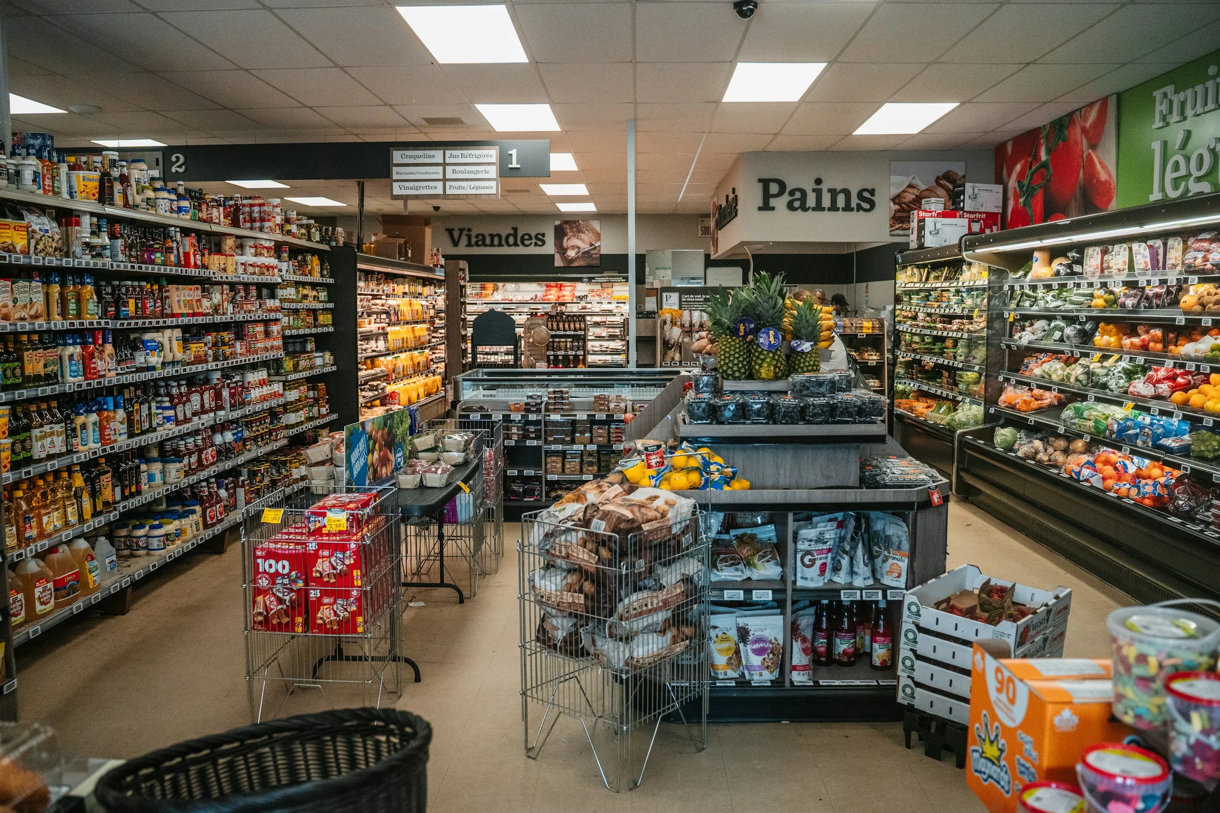 Grocery aisles and fresh produce with electronic shelf labels
